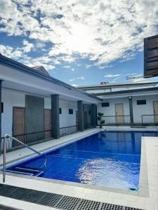 a large swimming pool in front of a building at Bavarian Guest House in Angeles