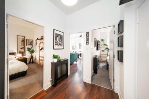 a bedroom with a bed and a living room at Princess Street Studios in Dundee