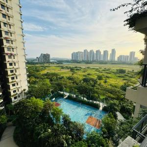 a view of a swimming pool from a building at Ataraxia park condo forest city in Gelang Patah