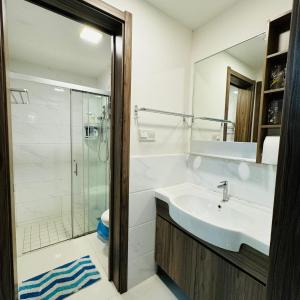 a bathroom with a sink and a shower at Ataraxia park condo forest city in Gelang Patah