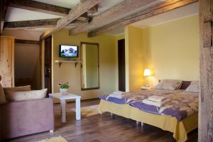 Voodi või voodid majutusasutuse Pööni Tavern & Guesthouse toas
