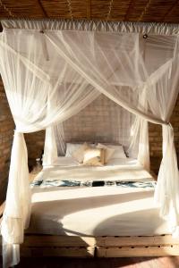 Katil atau katil-katil dalam bilik di Inhambane Bay View Home