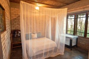 Katil atau katil-katil dalam bilik di Inhambane Bay View Home