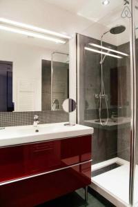 a bathroom with a shower and a sink at Saint-Paul Vieux Lyon - parking included in Lyon