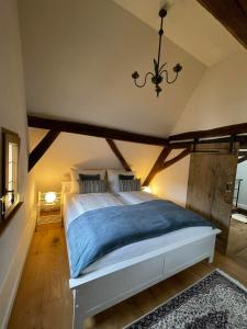 a bedroom with a large bed in a attic at Refugium Maikammer im "Haus Lotter" in Maikammer