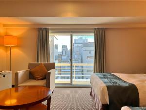 Postel nebo postele na pokoji v ubytování Nakajimaya Grand Hotel + 37 fotografií