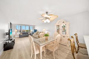 a dining room and living room with a table and chairs at Loggerhead Cay #434 in Sanibel