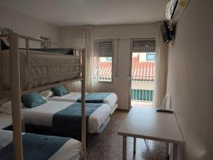 Postel nebo postele na pokoji v ubytování Hostal Garamar