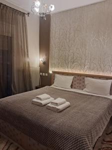 A bed or beds in a room at Erodios Guesthouse
