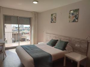 Postel nebo postele na pokoji v ubytování Hostal Garamar