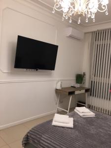 TV a/nebo společenská místnost v ubytování Sun apartments