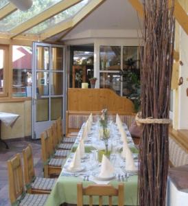 a long table in a room with chairs and tablesearcher at Gasthof & Hotel Wolfsegger in Engerwitzdorf