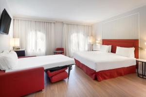 Posteľ alebo postele v izbe v ubytovaní Exe Sevilla Macarena