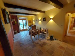 a dining room with a table in a room at Lahitte in Saint-Frajou