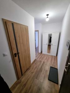 an empty room with a door and a hallway at Apartament Nad Wisłą u Ani in Tczew