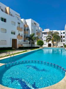 een zwembad voor een gebouw bij 2 Bedrooms 1 Bathrooms-2 Pools&With Direct beach Access in Tanger
