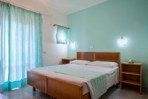 Posteľ alebo postele v izbe v ubytovaní Hotel Paradiso