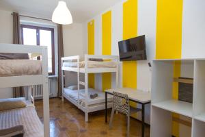 Ένα ή περισσότερα κρεβάτια σε δωμάτιο στο Guest House Turin Metro Young