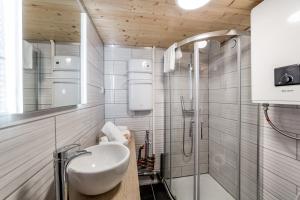 a bathroom with a sink and a shower at The charming studio in Croix-Rousse AIL in Lyon