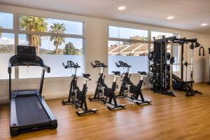 a gym with treadmills and elliptical machines at htop Olympic #htopEnjoy in Calella