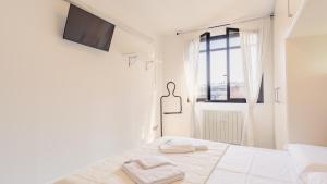 Llit o llits en una habitació de Fior di Loto - Italian Homing