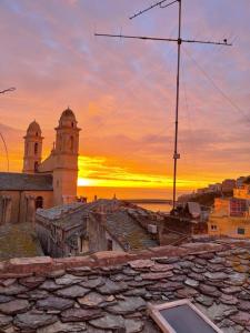 a view of a church with a sunset in the background at Appartement centre ville. in Bastia