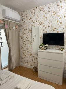 A television and/or entertainment centre at ORTIGIA 26