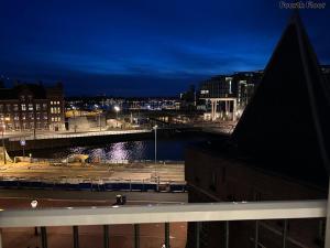 a view of a city skyline at night at Voyagers Amsterdam in Amsterdam