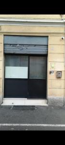 a large window in a building with graffiti on it at Fuori Portico Orso in Bologna