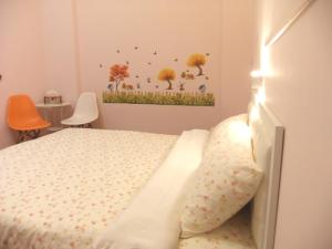 Postel nebo postele na pokoji v ubytování Jiufen Hui Ming Homestay