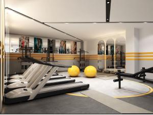 a gym with a bunch of equipment in a room at Rest&More by Dedeman Mardin Kızıltepe in Koçhisar