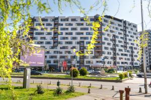 a large apartment building in the middle of a street at Unity Luxury Apartment - Skopje in Skopje