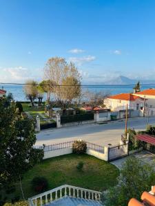 a view of a park with the ocean in the background at Attic House in Patra