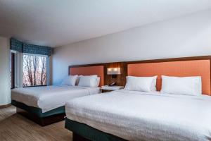 a hotel room with two beds and a window at Hampton Inn & Suites St. Louis-Chesterfield in Chesterfield