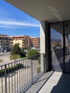 a balcony with a view of a parking lot at Itinera Home Residence in Montalto Uffugo