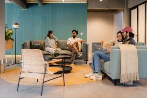 a group of people sitting in a waiting room at Outsite Mexico City Roma Sur - Work, Connect, Explore in Mexico City