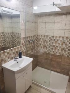Kúpeľňa v ubytovaní Szilvásváradi Kemencés Apartmanok