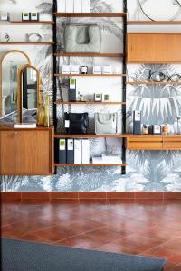 a bathroom with a vanity and a mirror at Casa Idalia Boutique Hotel in Comporta