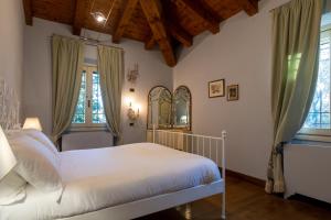 Ένα ή περισσότερα κρεβάτια σε δωμάτιο στο Villa Zarri Guest House