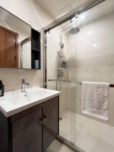a bathroom with a sink and a shower at Cozy Condo Baguio (Megatower-IV) near Session Road in Baguio