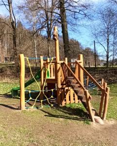 a playground in a park with a slide at Apartmán STŘEVLIK Oldřichov v Hájích in Oldřichov v Hájích