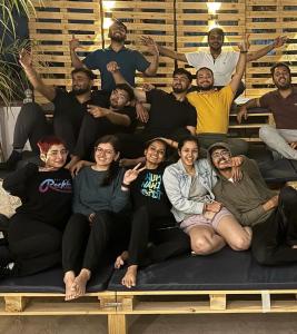 a group of people posing for a picture on a bed at Bunky in Jaipur