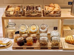 a bakery with shelves filled with various types of bread at Musik Boutique Hotel - Solo Adultos in Barcelona