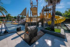 a water park with a slide and a pool at Camping La Masia - Maeva Vacansoleil in Blanes