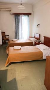 Postel nebo postele na pokoji v ubytování Hotel Liberty