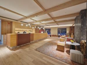 a large room with a kitchen and a table at DoubleTree by Hilton Changbaishan Hot Spring in Antu