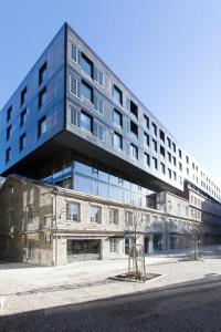 a large building with a lot of windows at Cozy city apartment in Tallinn