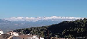 a view of a mountain range with snow covered mountains at Casa María in Moclín +4 photos
