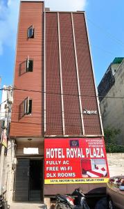 a hotel royal plaza with a sign in front of a building at Hotel Royal Plaza B&B in New Delhi