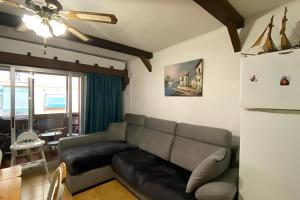 a living room with a couch and a table at Apartement "Brisa Marina" - 500 m from the beach in Benidorm